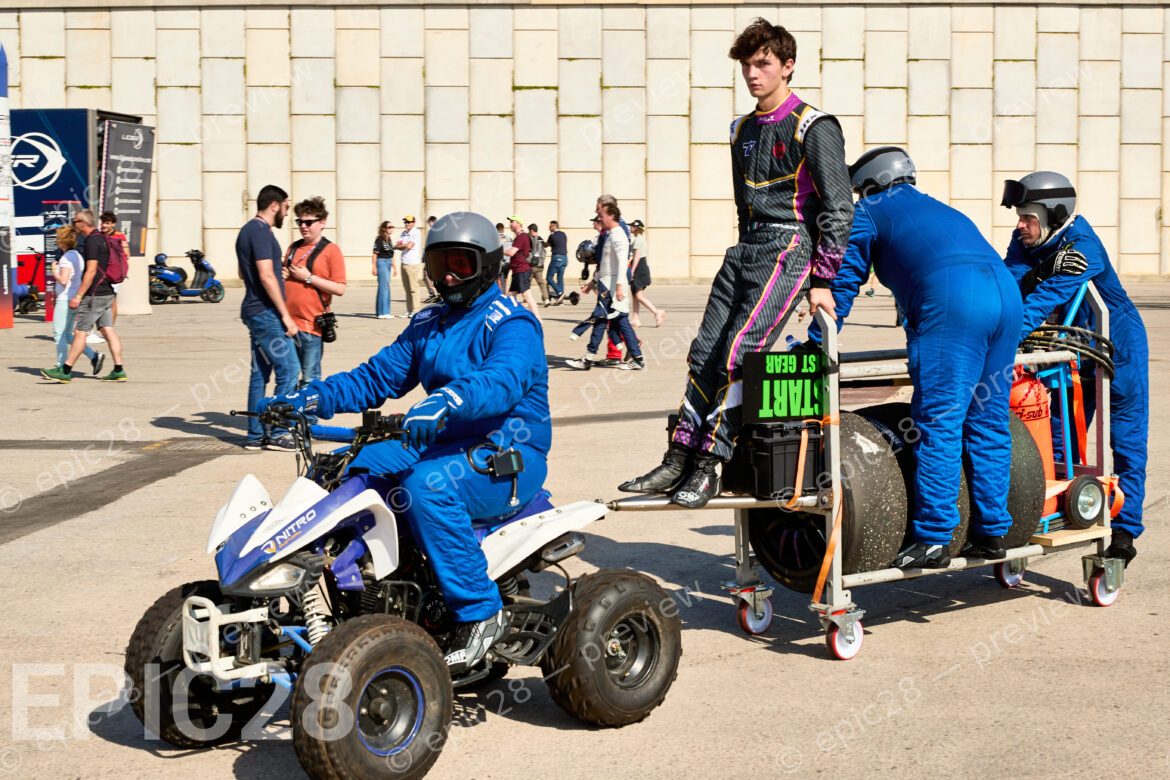 Driver hitches a ride with Mechanics in the paddock. 2025 LIGIER EUROPEAN SERIES Round 6 in PORTIMÃO, Portugal on 17th October 2025.