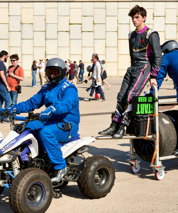 Driver hitches a ride with Mechanics in the paddock. 2025 LIGIER EUROPEAN SERIES Round 6 in PORTIMÃO, Portugal on 17th October 2025.